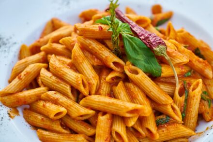 How do Italians sauce pasta