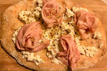 Pinsa with mortadella, pistachios and ricotta